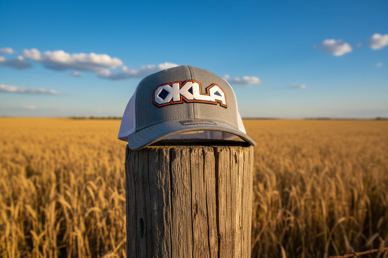 Gray cap with 'OKLA' logo on a light gray background