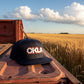 Navy blue cap with 'OKLA' text on a white background