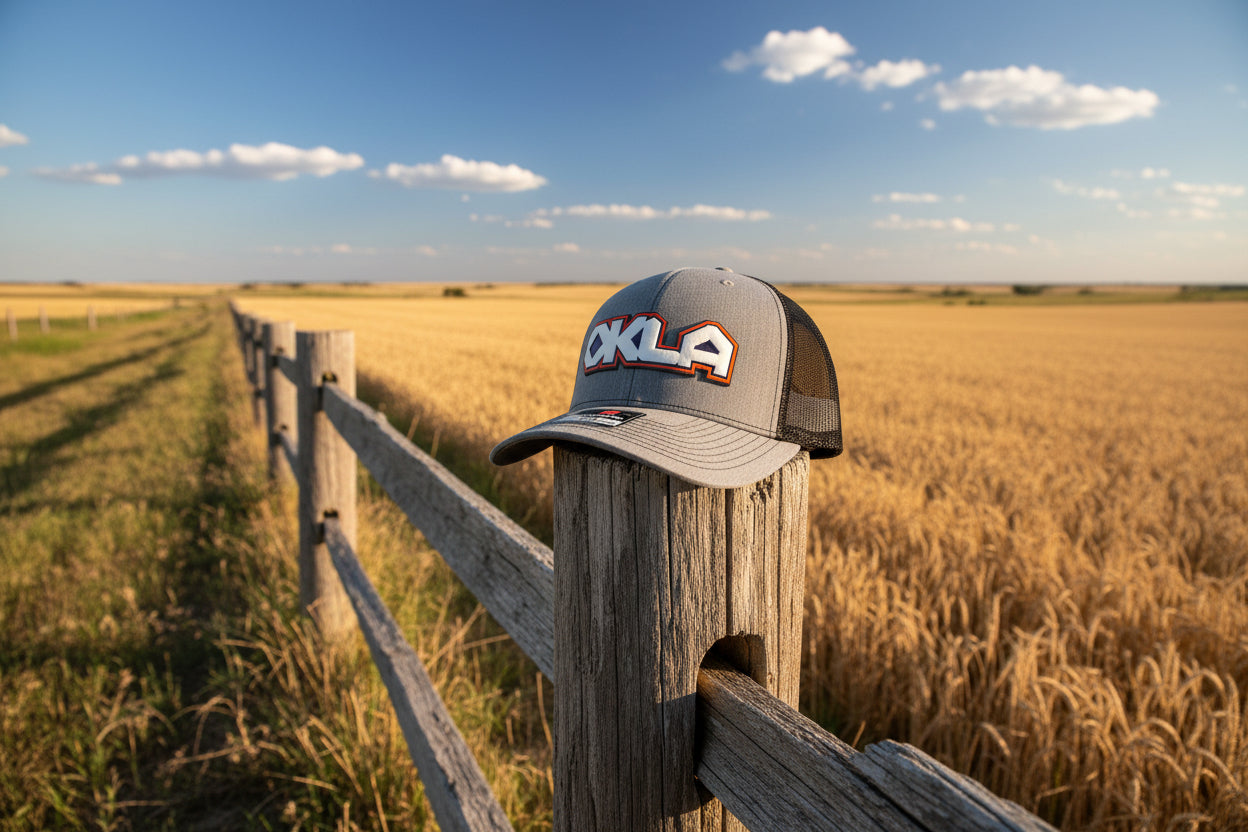 Gray cap with 'OKLA' logo on a white background