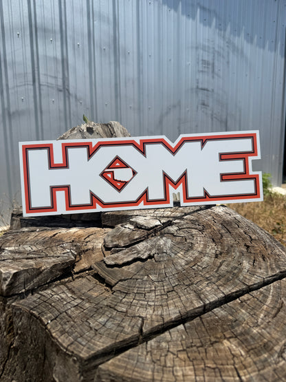Sticker with a logo on a wooden log against a metal background