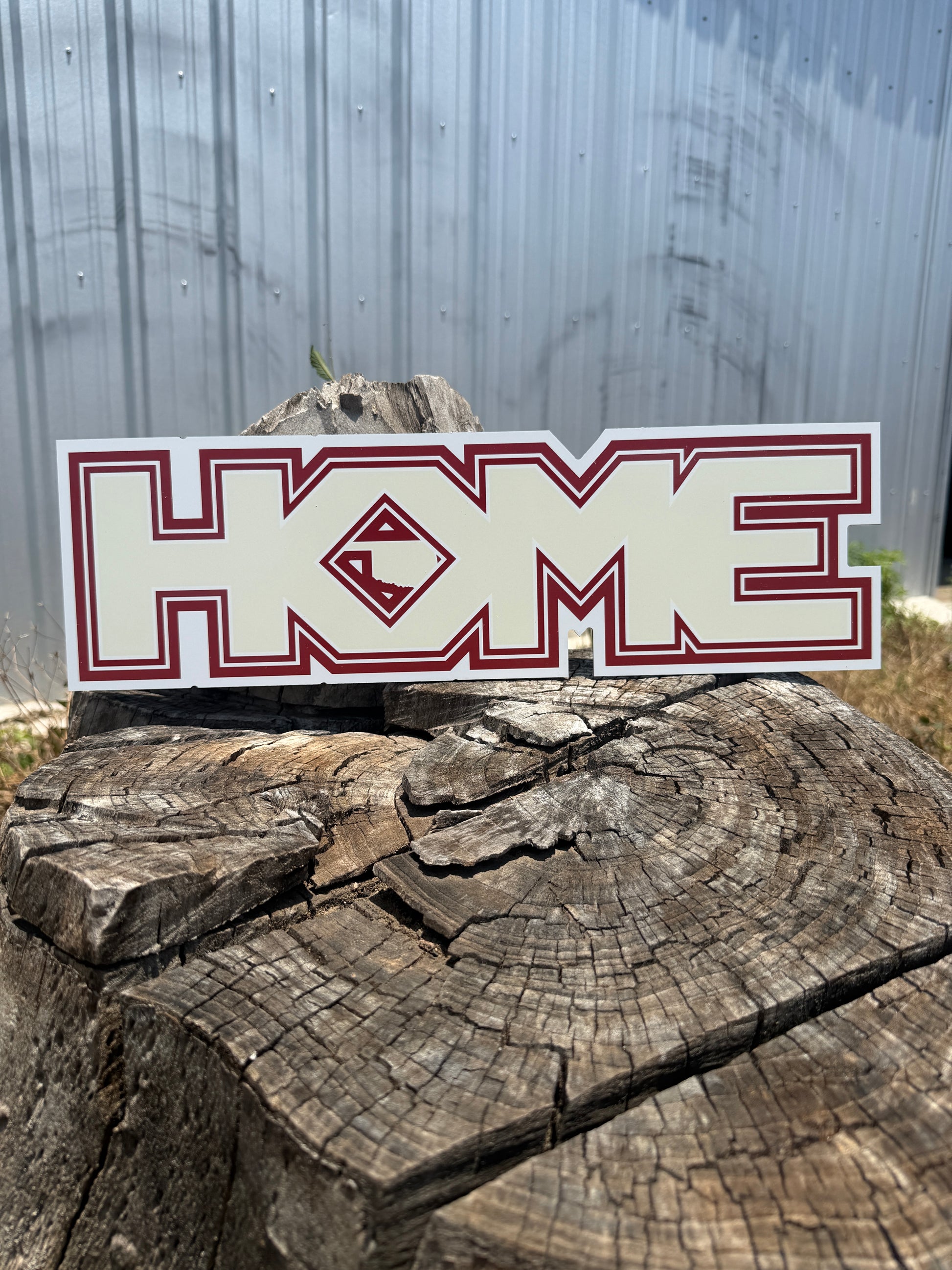 Decal with a logo on a wooden log against a metal background