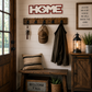 Nestled entryway with wooden bench, coat rack, and decorative items against a white paneled wall.